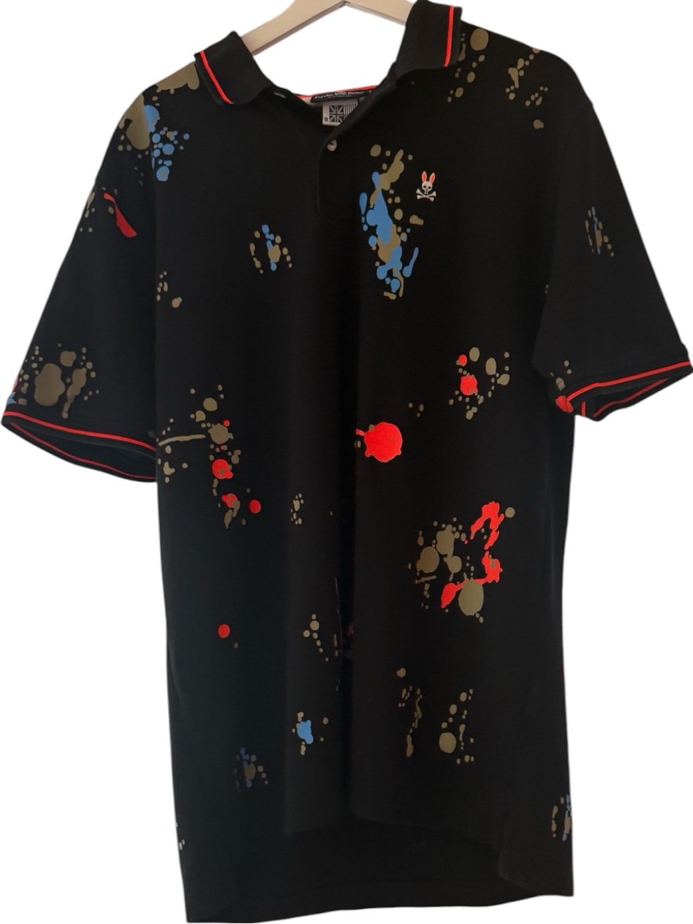 Psycho Bunny Black Polo with Red and Blue Paint-Splash Accents